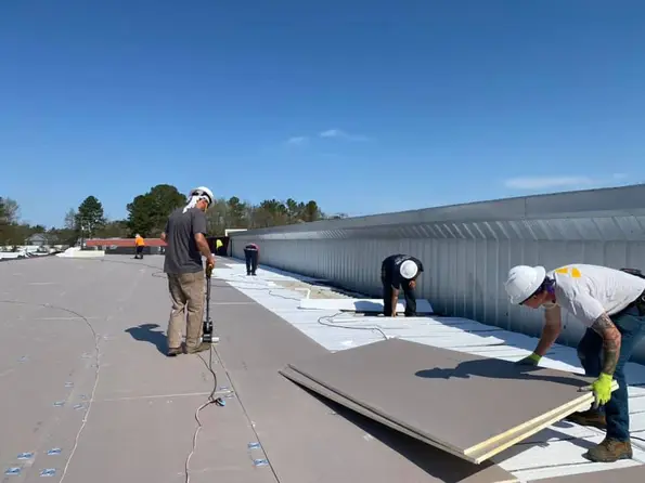 workers repairing commercial roof