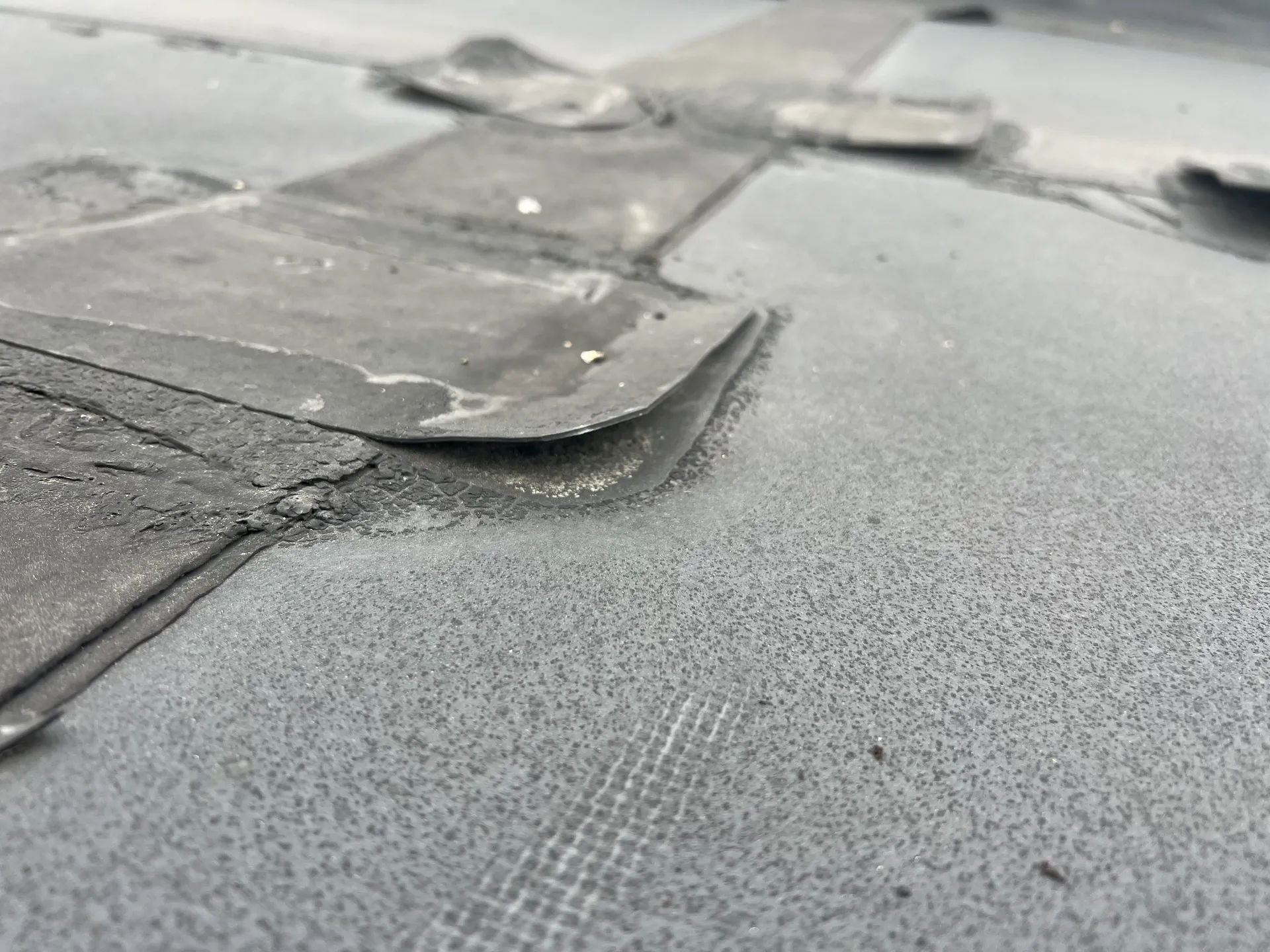 commercial flat roof with wear and tear in need of repair